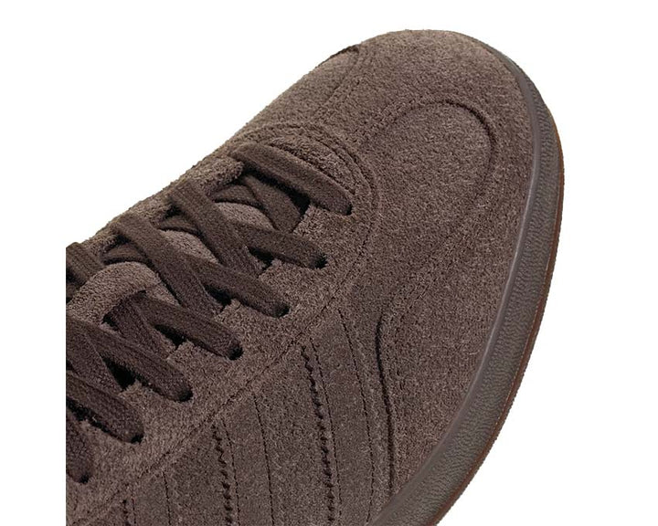 Indoor running shoes made of dark brown suede