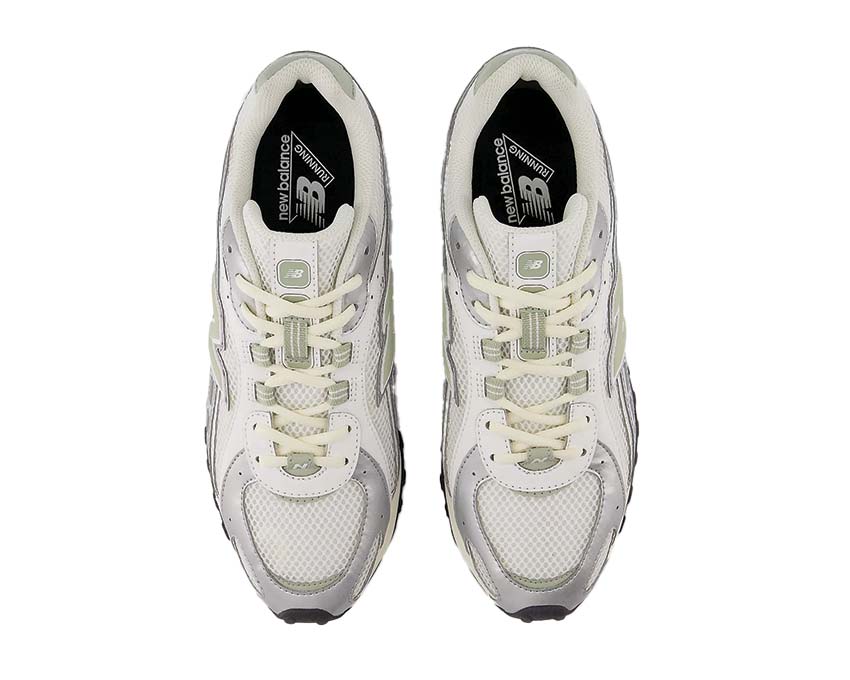 Leather and textile sneakers with a snake-inspired design.