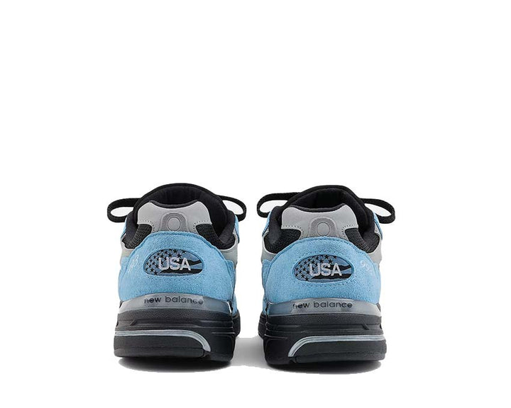 Running shoes made of leather and textile, produced in the United States, navy blue.