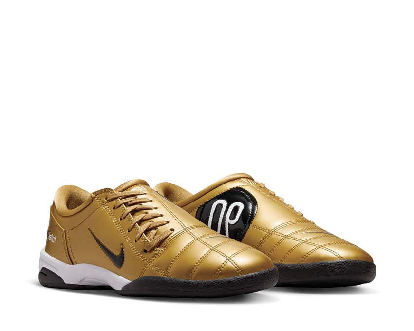 Football boots made of synthetic leather in metallic gold.