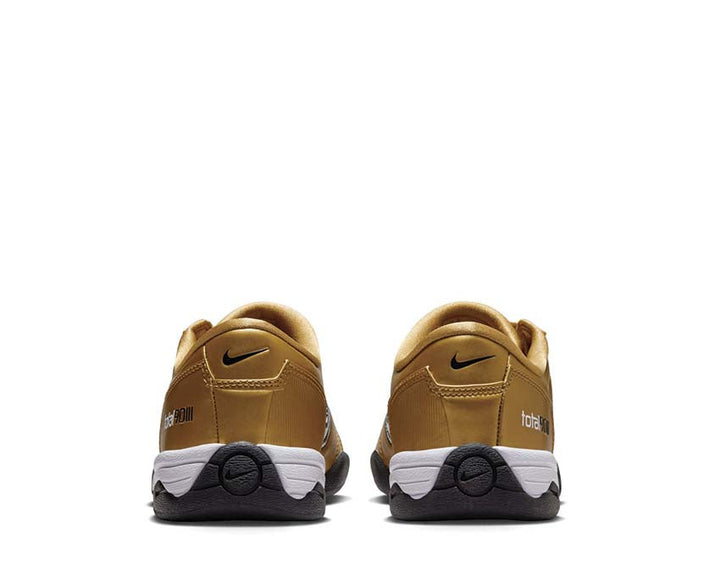 Football boots made of synthetic leather in metallic gold.