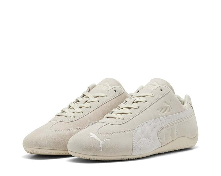 Low white leather sports shoes for driving and everyday wear