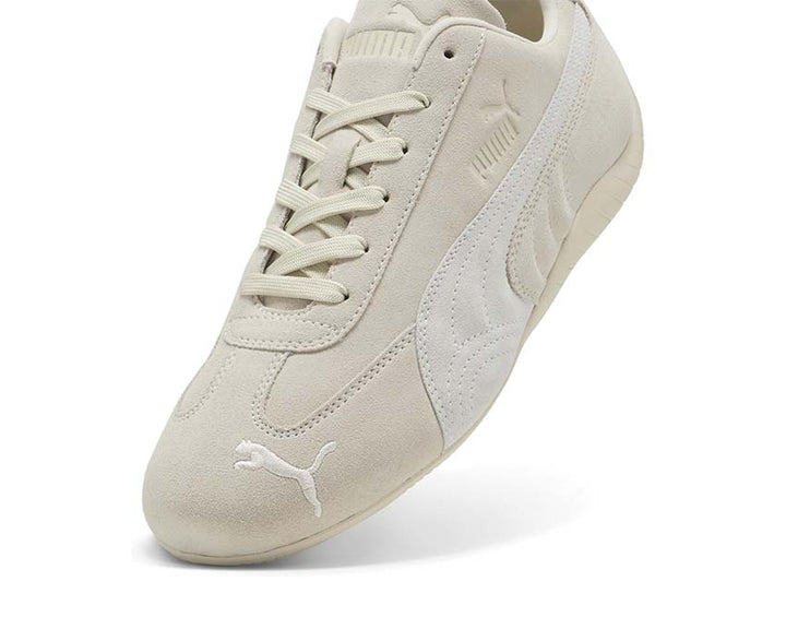Low white leather sports shoes for driving and everyday wear